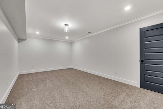 carpeted empty room featuring baseboards, ornamental molding, visible vents, and recessed lighting