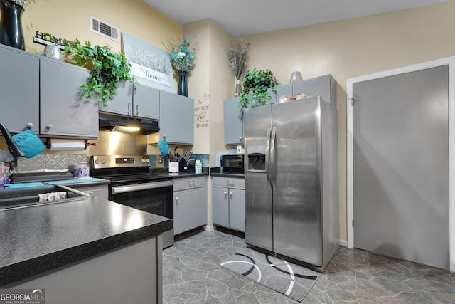 kitchen featuring appliances with stainless steel finishes, sink, and gray cabinetry