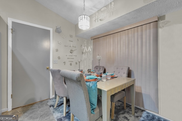 dining room featuring a chandelier