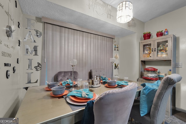 dining area with a textured ceiling