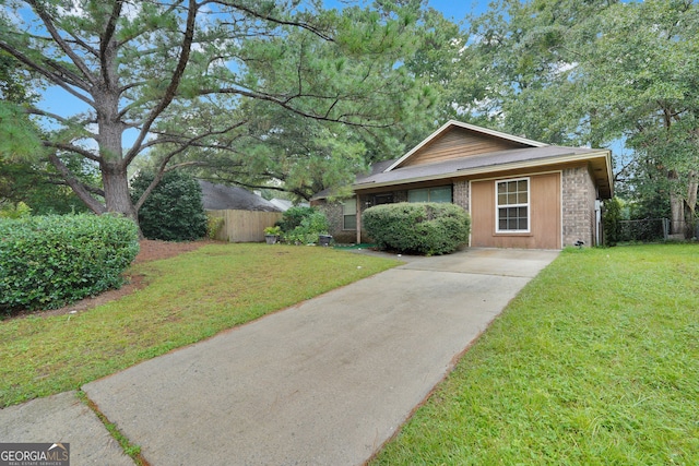 single story home featuring a front yard