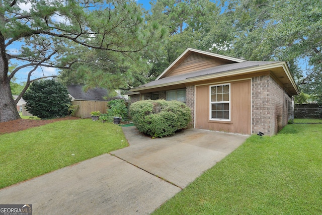 view of home's exterior with a lawn