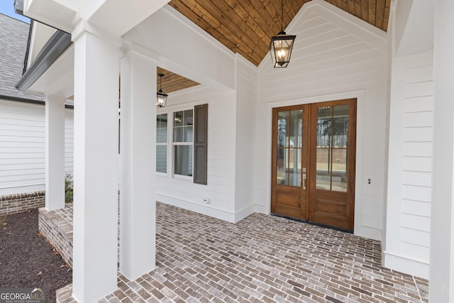 property entrance featuring french doors and ceiling fan