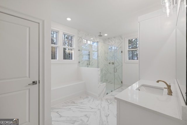 bathroom with vanity and a shower with shower door