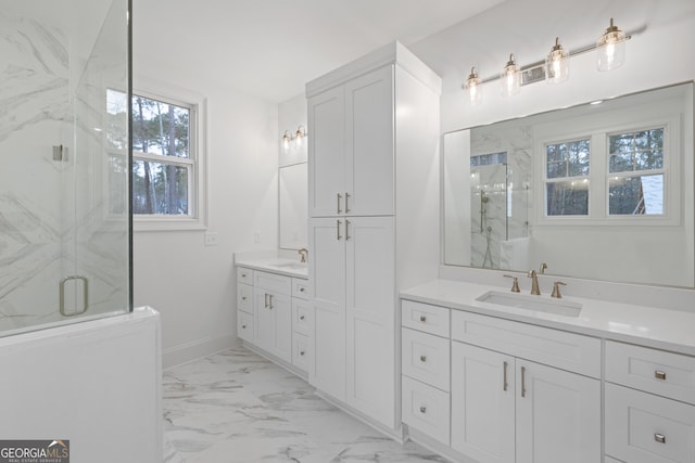 bathroom with vanity and an enclosed shower