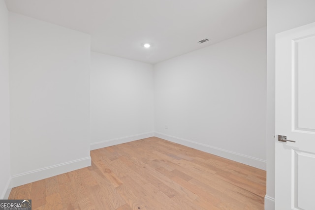 spare room featuring light hardwood / wood-style flooring