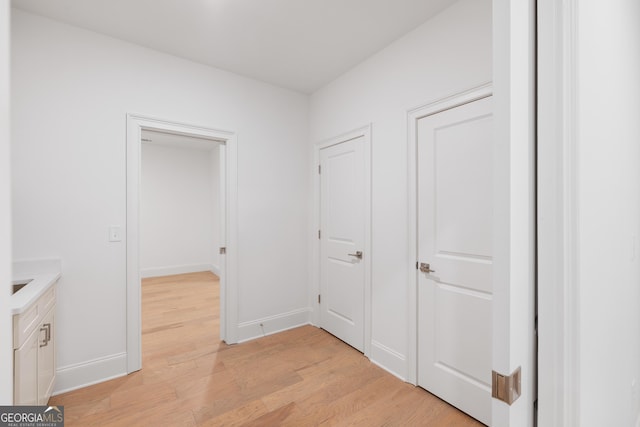 hall with light hardwood / wood-style flooring