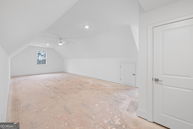 additional living space featuring ceiling fan and vaulted ceiling