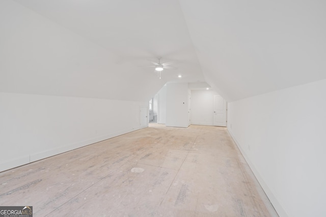 additional living space featuring ceiling fan and lofted ceiling