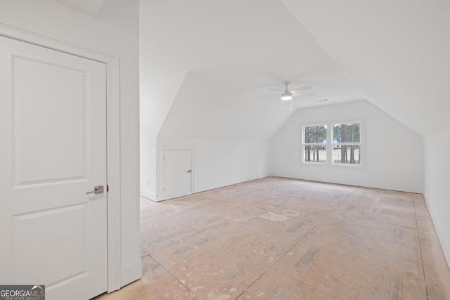 additional living space featuring vaulted ceiling and ceiling fan