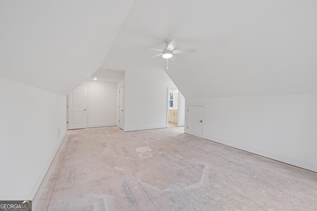 additional living space with vaulted ceiling and ceiling fan