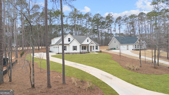 tudor-style house with a garage and a front lawn