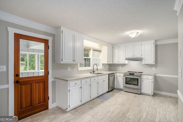 kitchen with stainless steel appliances and white cabinets