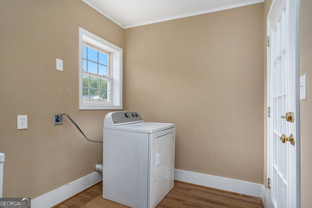 laundry room with ornamental molding, washer / clothes dryer, and hardwood / wood-style flooring