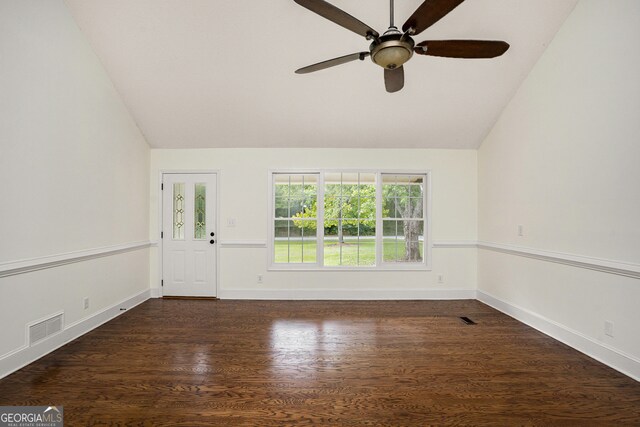 spare room featuring vaulted ceiling, ceiling fan, and dark hardwood / wood-style flooring