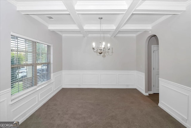 carpeted spare room featuring coffered ceiling, beamed ceiling, a notable chandelier, and crown molding