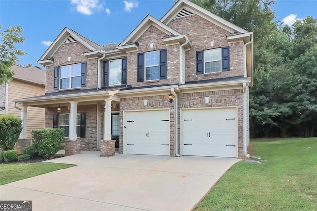 craftsman-style house with a garage, covered porch, and a front yard