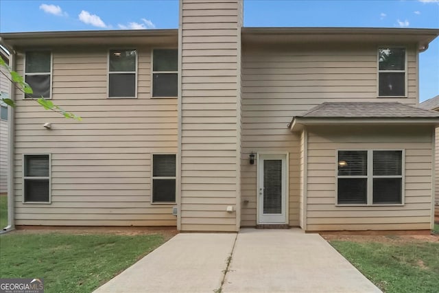 rear view of house featuring a patio