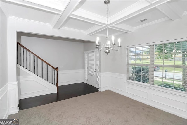 entrance foyer featuring dark hardwood / wood-style flooring, a notable chandelier, beam ceiling, coffered ceiling, and crown molding