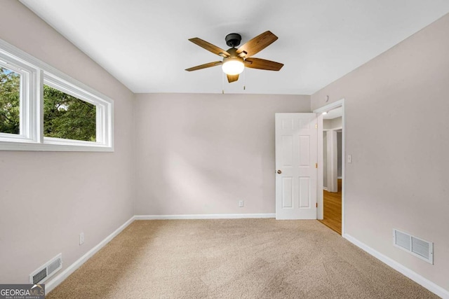 carpeted empty room with ceiling fan