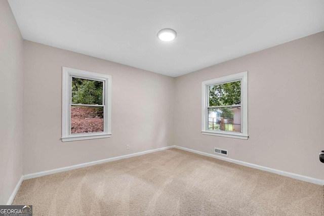 unfurnished room featuring carpet floors