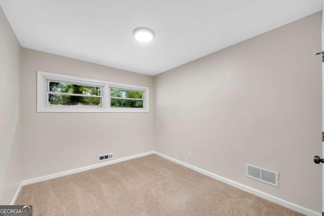 unfurnished room with carpet floors