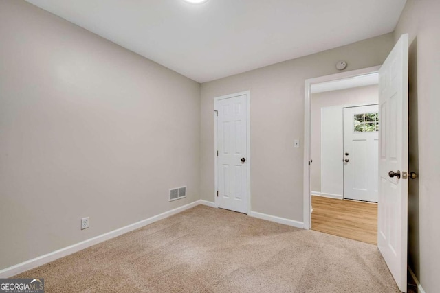 unfurnished bedroom featuring carpet