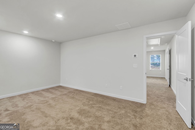 empty room featuring light colored carpet