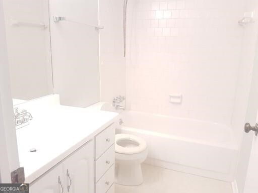 full bathroom featuring vanity, toilet, and tiled shower / bath