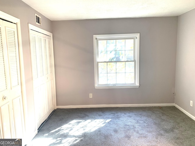 unfurnished bedroom with carpet flooring