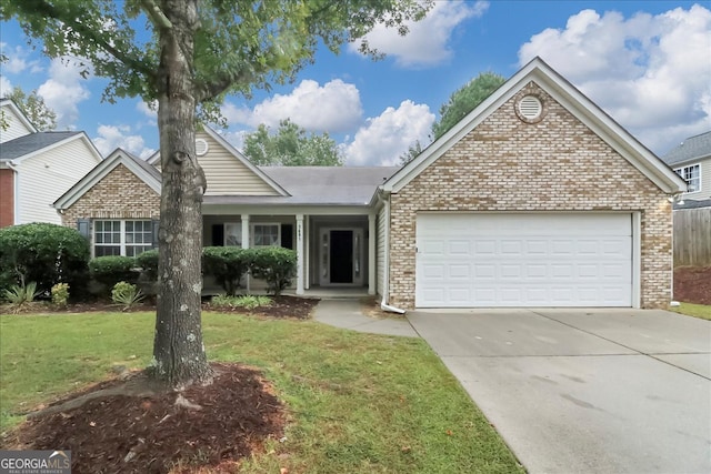 view of front of home with a garage and a front yard