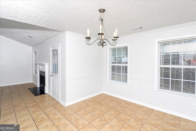 unfurnished dining area with a textured ceiling, crown molding, an inviting chandelier, and light tile patterned floors