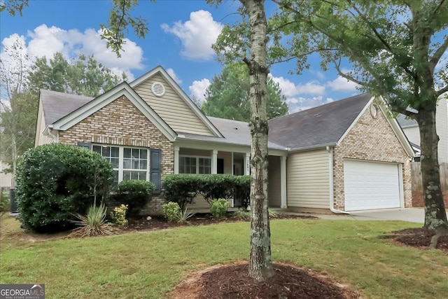 view of front of property featuring a front lawn and a garage