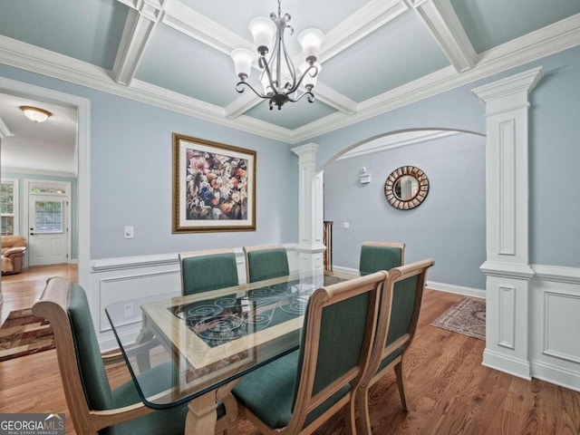 carpeted bedroom featuring a raised ceiling, ceiling fan, and ornamental molding