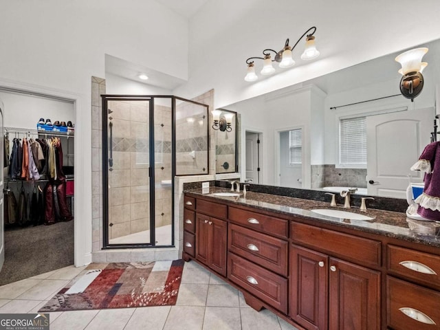 bathroom featuring separate shower and tub and vanity