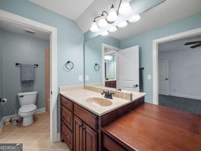 full bathroom with tile patterned flooring, vanity, toilet, and tiled shower / bath