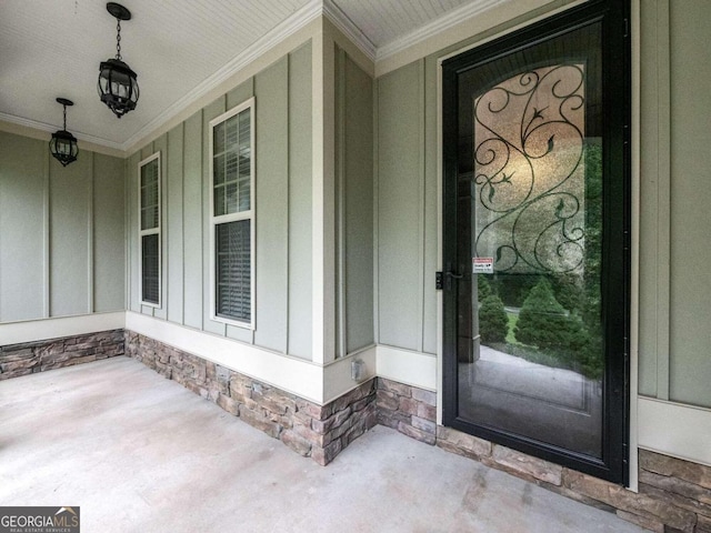 entryway featuring beam ceiling, ceiling fan, decorative columns, crown molding, and light wood-type flooring