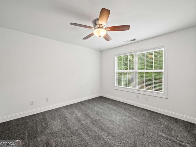 carpeted empty room with ceiling fan