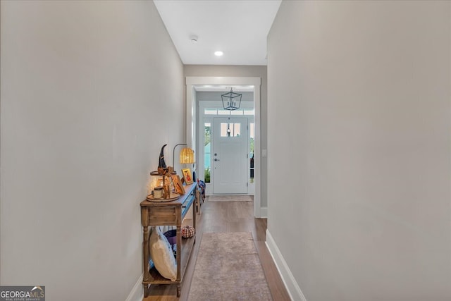 hallway with light hardwood / wood-style flooring