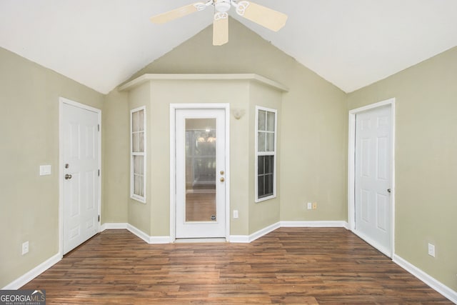 unfurnished room featuring ceiling fan, lofted ceiling, and dark hardwood / wood-style flooring