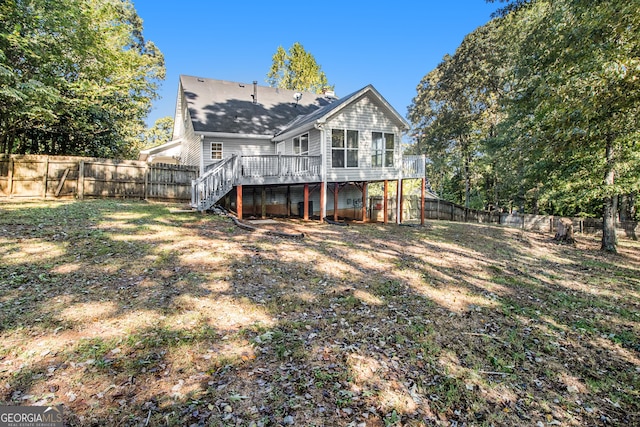 rear view of house featuring a deck