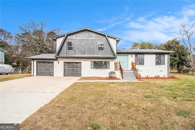 view of front of property with a front yard and a garage