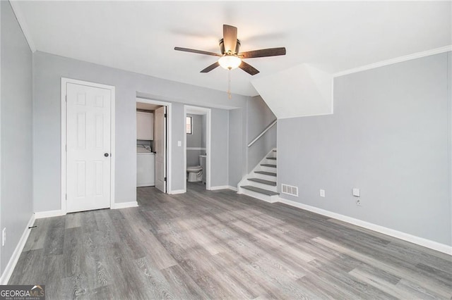 unfurnished living room featuring ornamental molding, wood-type flooring, and ceiling fan