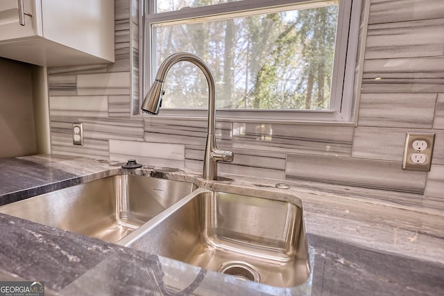 interior details with decorative backsplash and sink