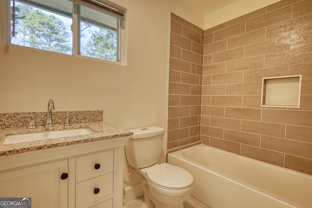 full bathroom with tiled shower / bath, vanity, toilet, and tile patterned floors