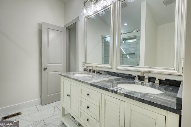 bathroom featuring an enclosed shower and vanity