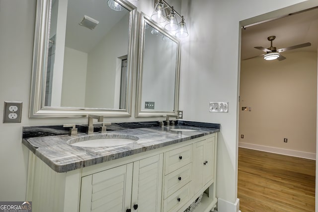 bathroom with vanity, lofted ceiling, ceiling fan, and hardwood / wood-style floors