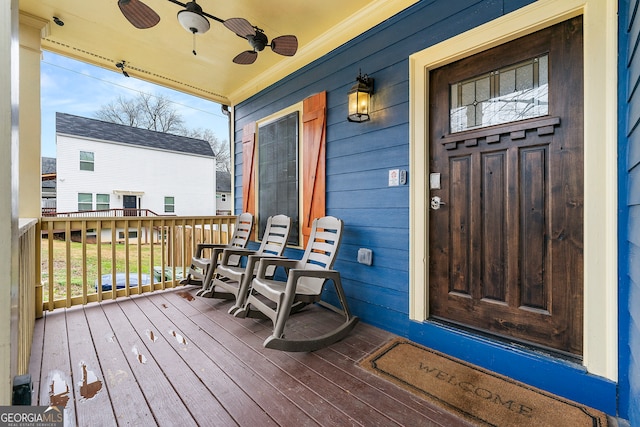 deck featuring ceiling fan and a porch