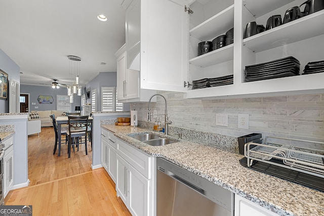 kitchen featuring light hardwood / wood-style flooring, white cabinets, appliances with stainless steel finishes, and sink