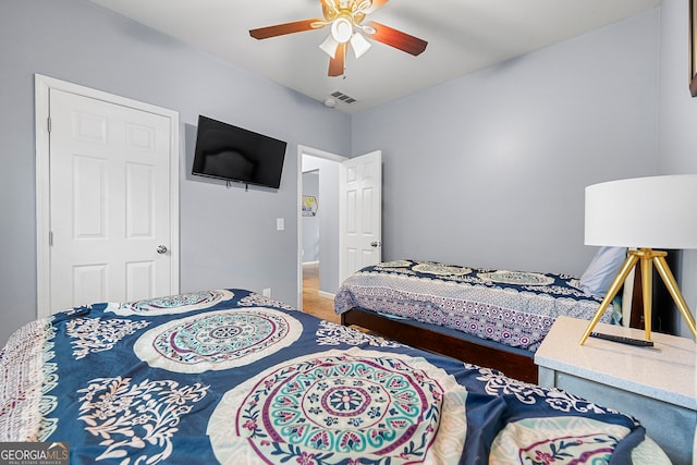 bedroom featuring ceiling fan and hardwood / wood-style floors